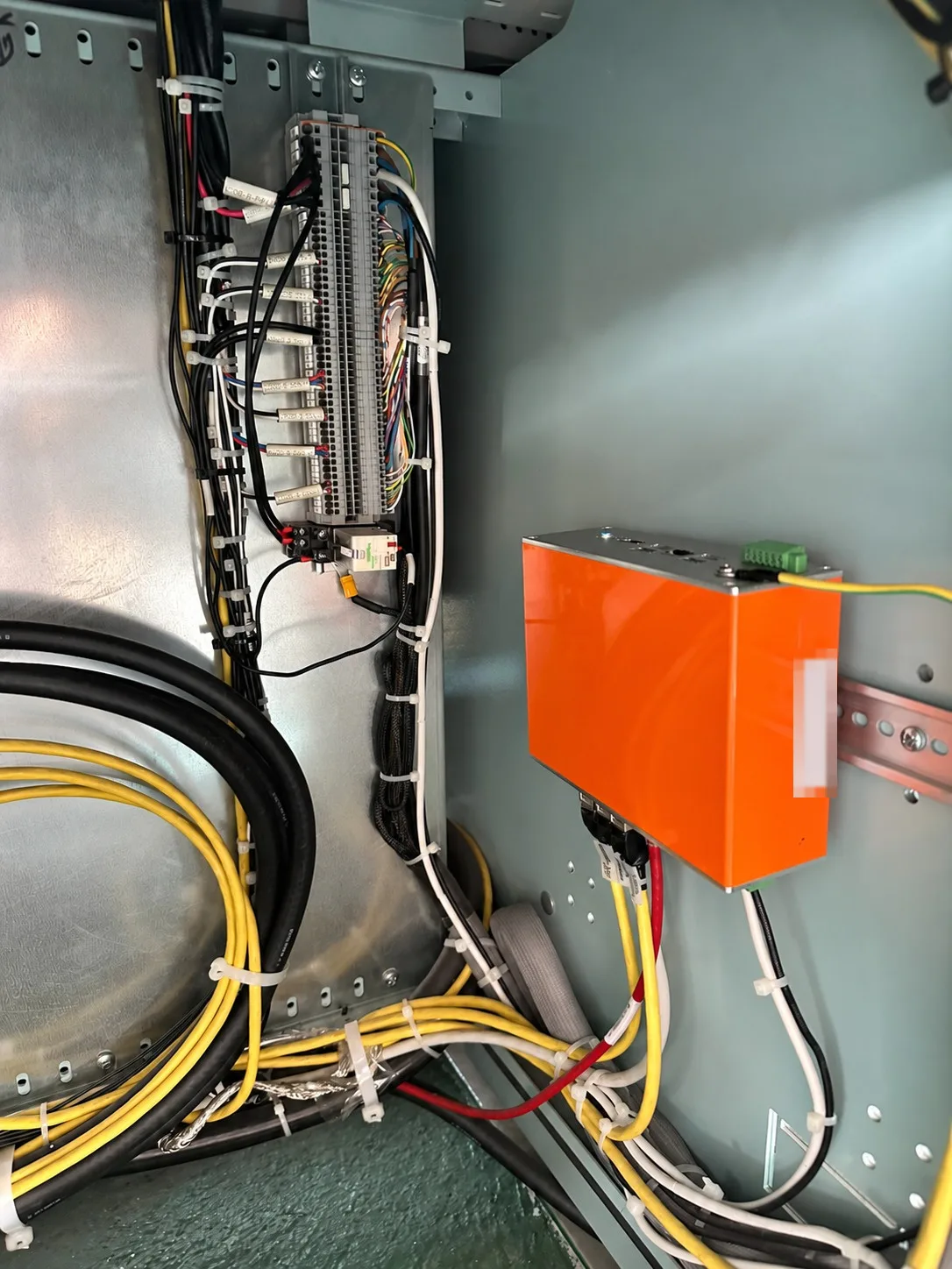 ECDIS interface cabinet with terminal blocks, labelled sensor cables and a marine network switch