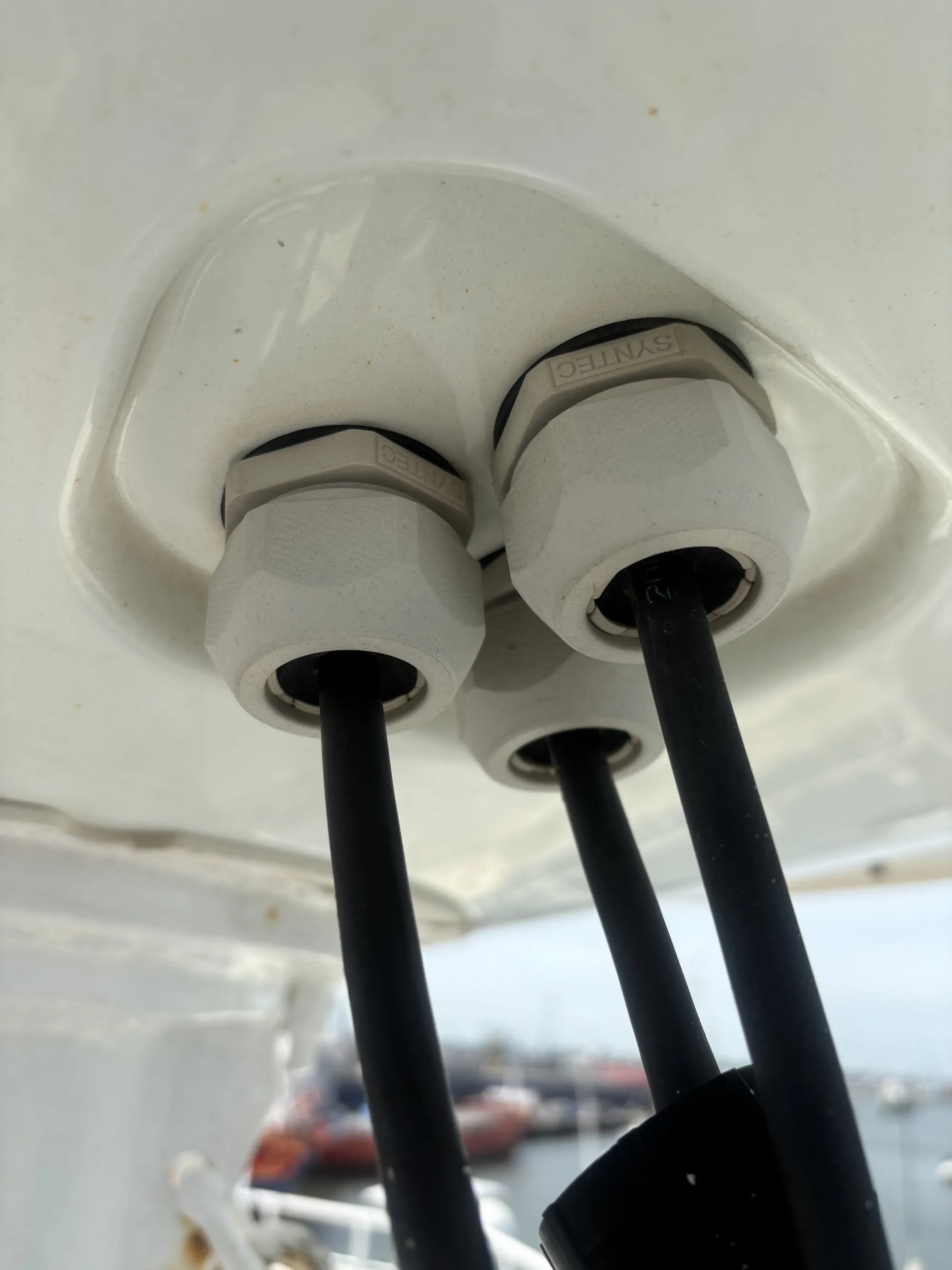 Cable glands at the base of the VSAT radome checked for moisture ingress